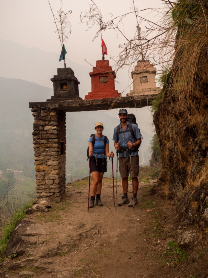 Crossing through the haze and under an archway of Buddhist stupas